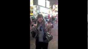 My Nana with a snake in Times Square, NYC